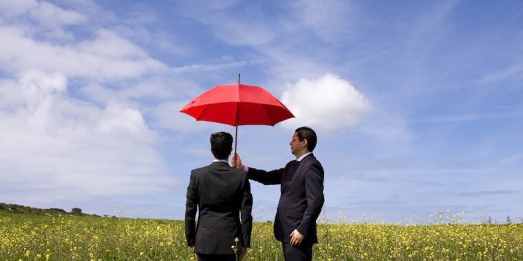 business man holding umbrella Wintson-Salem NC
