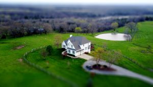 Large house on a green hill.