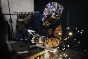 Man welding.