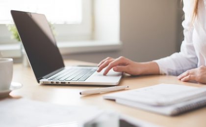 Woman on a laptop.