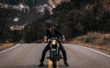 Man thinking about motorcycle safety on a motorcycle.