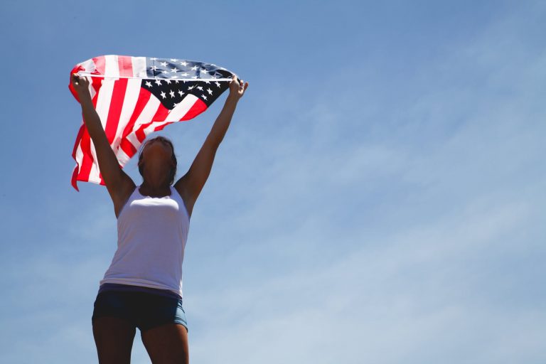 Woman holding American flag.