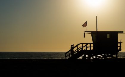 Flag waving on lifeguard stand in California.