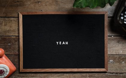 The word "Yeah" on a blackboard.