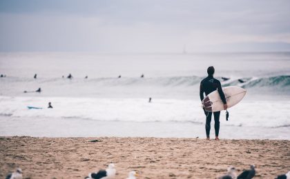 Surfer looking at waves.