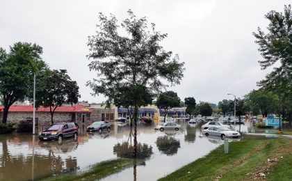 Cars and homes in a flood without flood insurance.