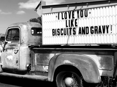 Work truck with sign.