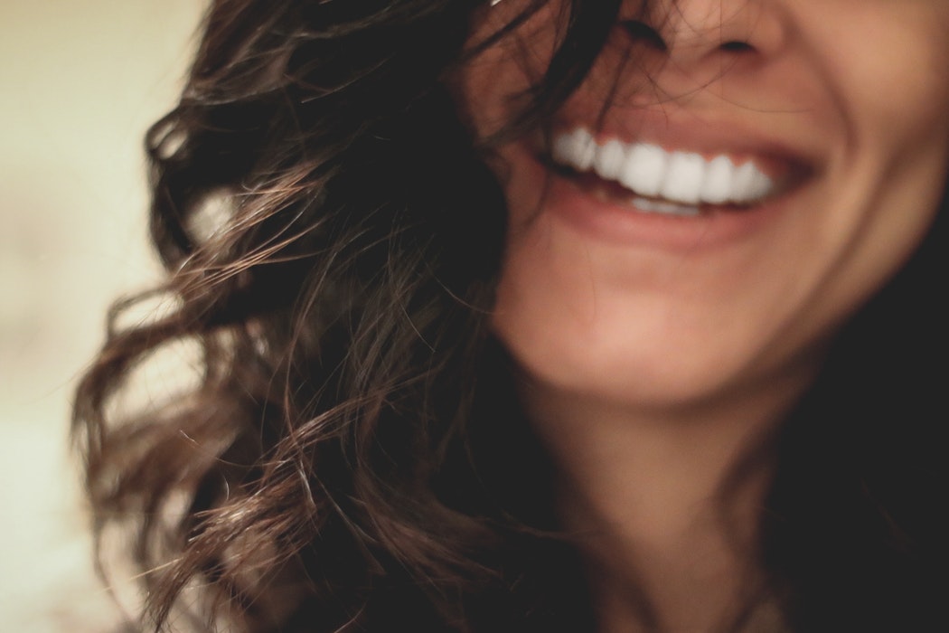 Woman smiling about DMEPOS bonds.