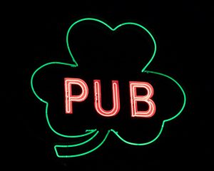 Neon shamrock sign that reads: Pub.