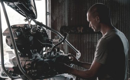 Mechanic working on engine.