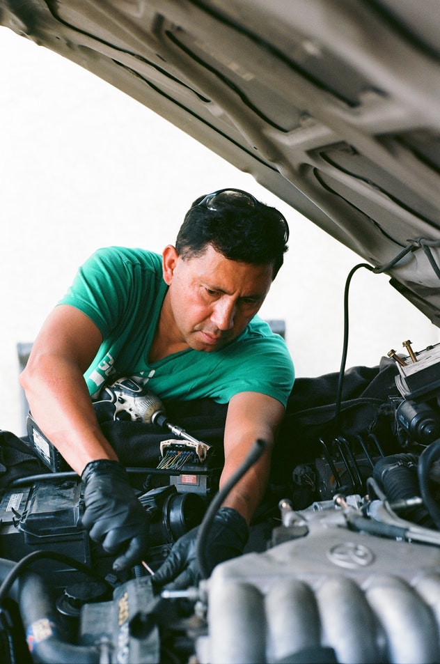 Man working on car.