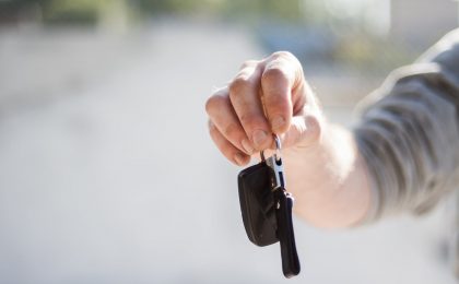 Dealer handing keys to new customer.