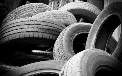 A bunch of tires at a tire dealership.