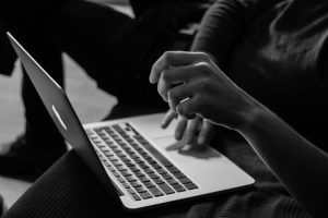 Man on computer about to cause a Cyber Liability claim.