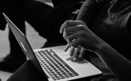 Man on computer about to cause a Cyber Liability claim.