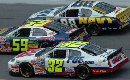 NASCAR cars close together.