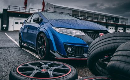 Car next to tires.