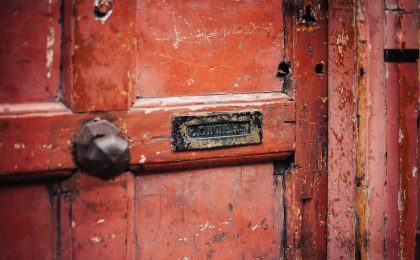 Worn door not covered by homeowners policy.