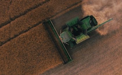 Farm equipment in use in field.