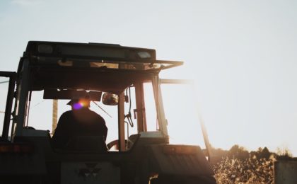 Farmer on tractor.