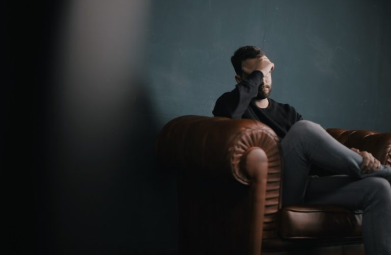 Man who has been laid off in room alone.