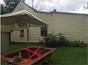 Hot tub used as a lounge area in yard.