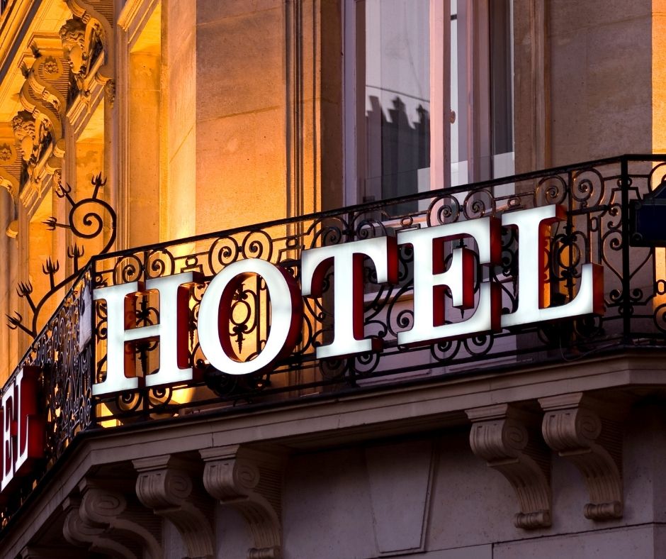 A hotel sign that reads, "Hotel."