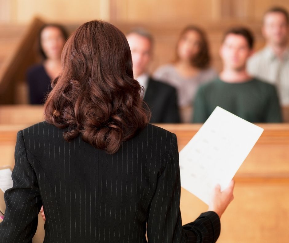 Female attorney speaking to a jury.