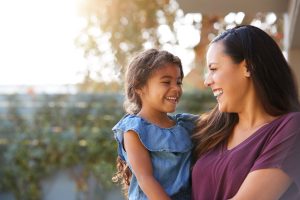 Child life insurance. Smiling mother and daughter