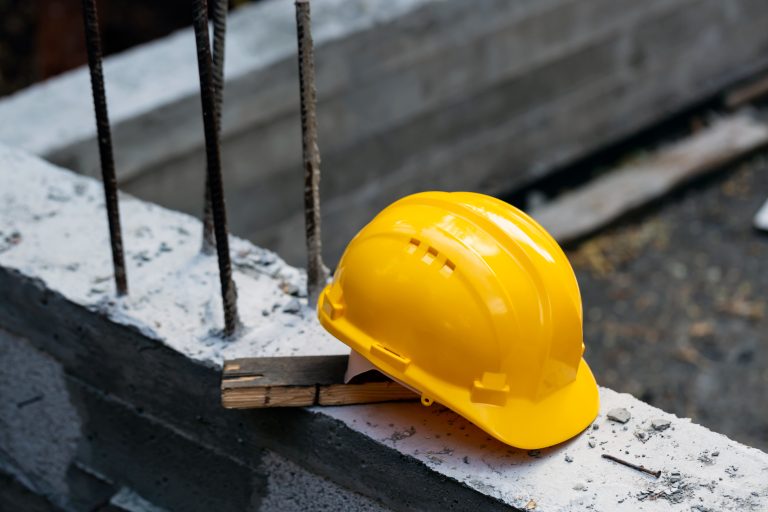 Image of hardhat and worker's compensation and worker's compensation insurance