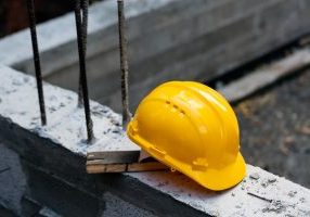 Image of hardhat and worker's compensation and worker's compensation insurance